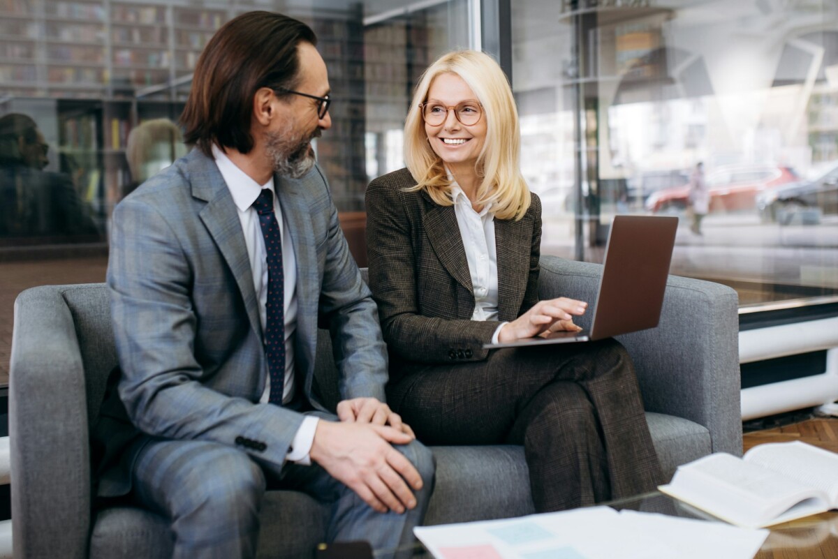 business colleagues formal man woman formal work laptop
